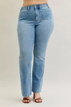 Light blue mid-rise bootcut jeans with front patch pockets and contrast wash