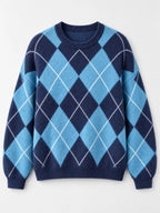 Fuzzy argyle knit sweater flat lay in sky blue and navy with white diamond pattern