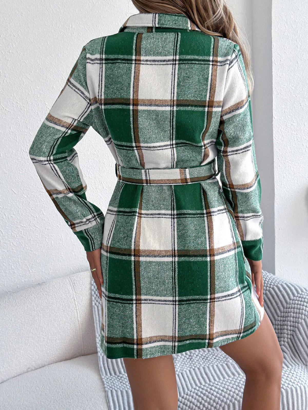 Green plaid shirt dress viewed from back, belted waist, long sleeves