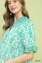 Turquoise geometric puff sleeve smocked blouse with ruffled cuff detail