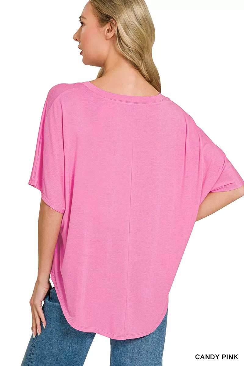 Candy pink oversized V-neck top, back view with wide sleeves