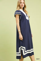 Navy linen-cotton midi dress with V-neck and white-trim border, side view