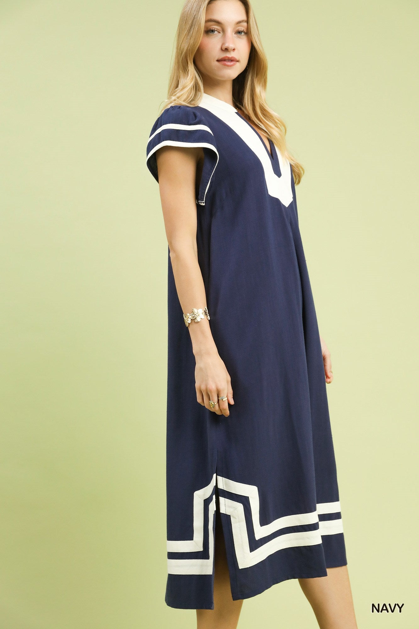 Navy linen-cotton midi dress with V-neck and white-trim border, side view