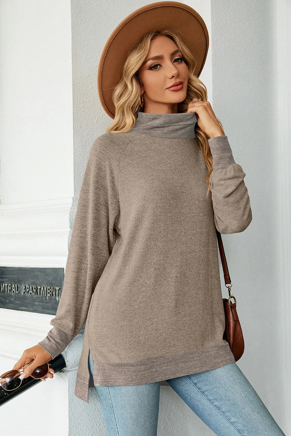 Mock-neck long-sleeve slit tee, heather gray-brown, relaxed fit with curved hem and side slit.