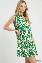 Green sleeveless V-neck tiered mini dress with white floral print, front view