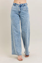Plus size high-waist wide-leg jeans in light wash denim with button fly
