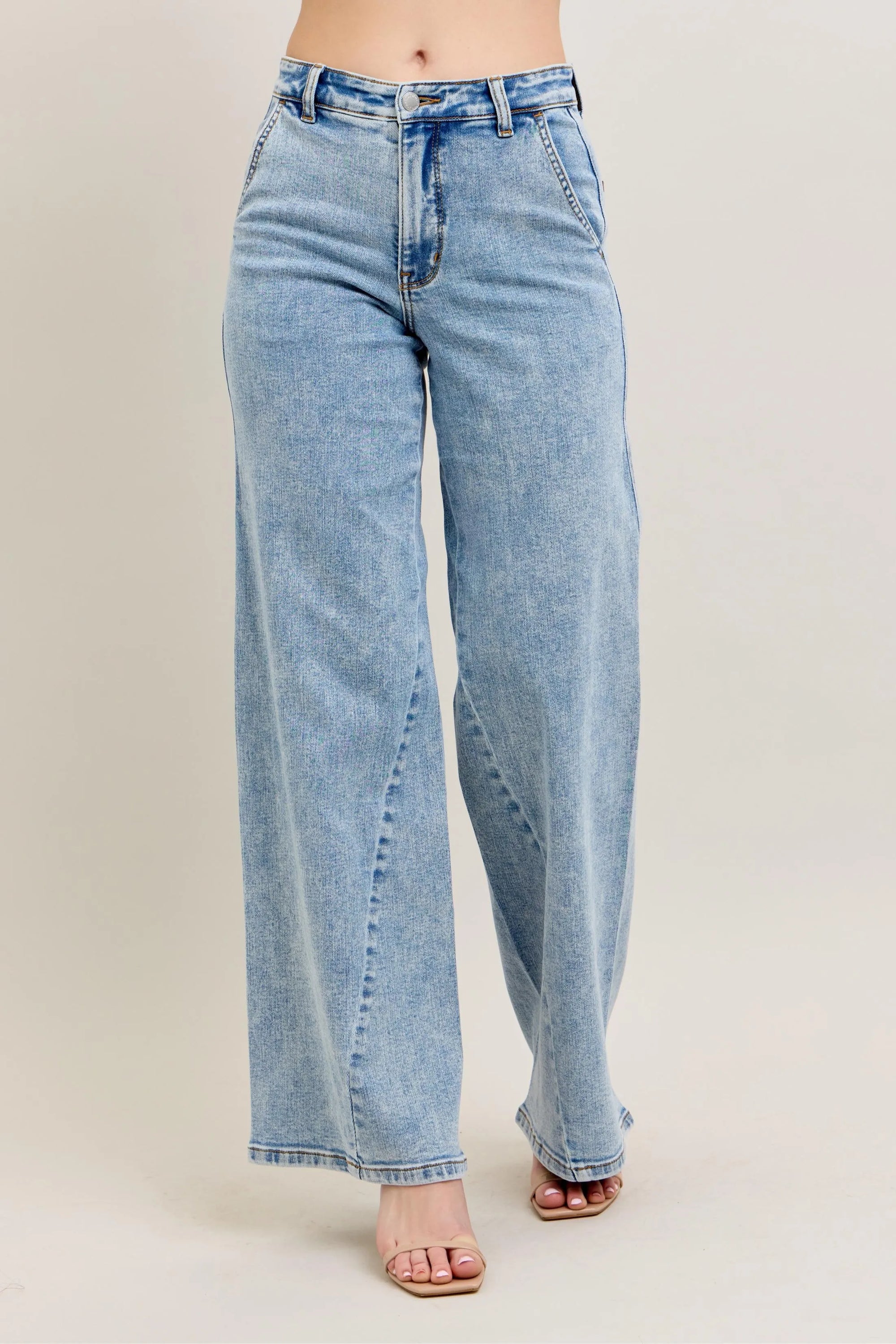 Plus size high-waist wide-leg jeans in light wash denim with button fly
