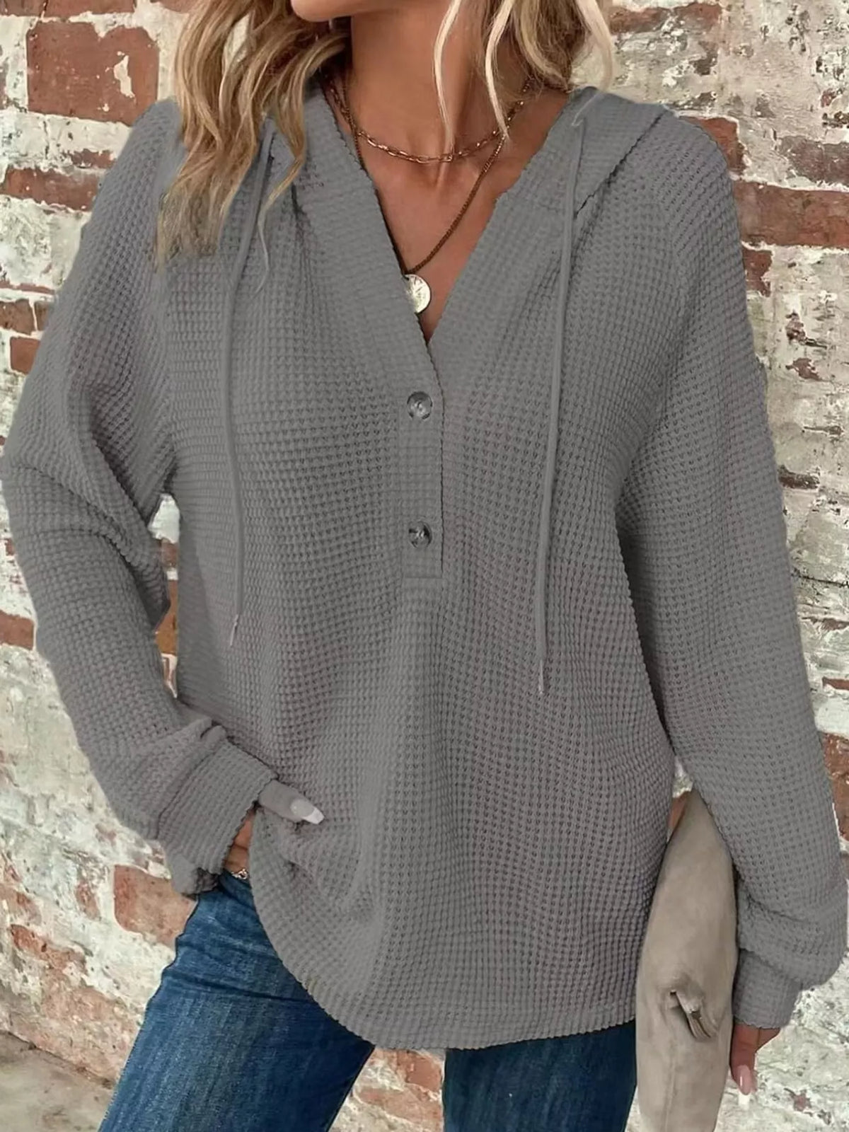 Gray waffle-knit button hoodie with hood, drawstring ties and long sleeves