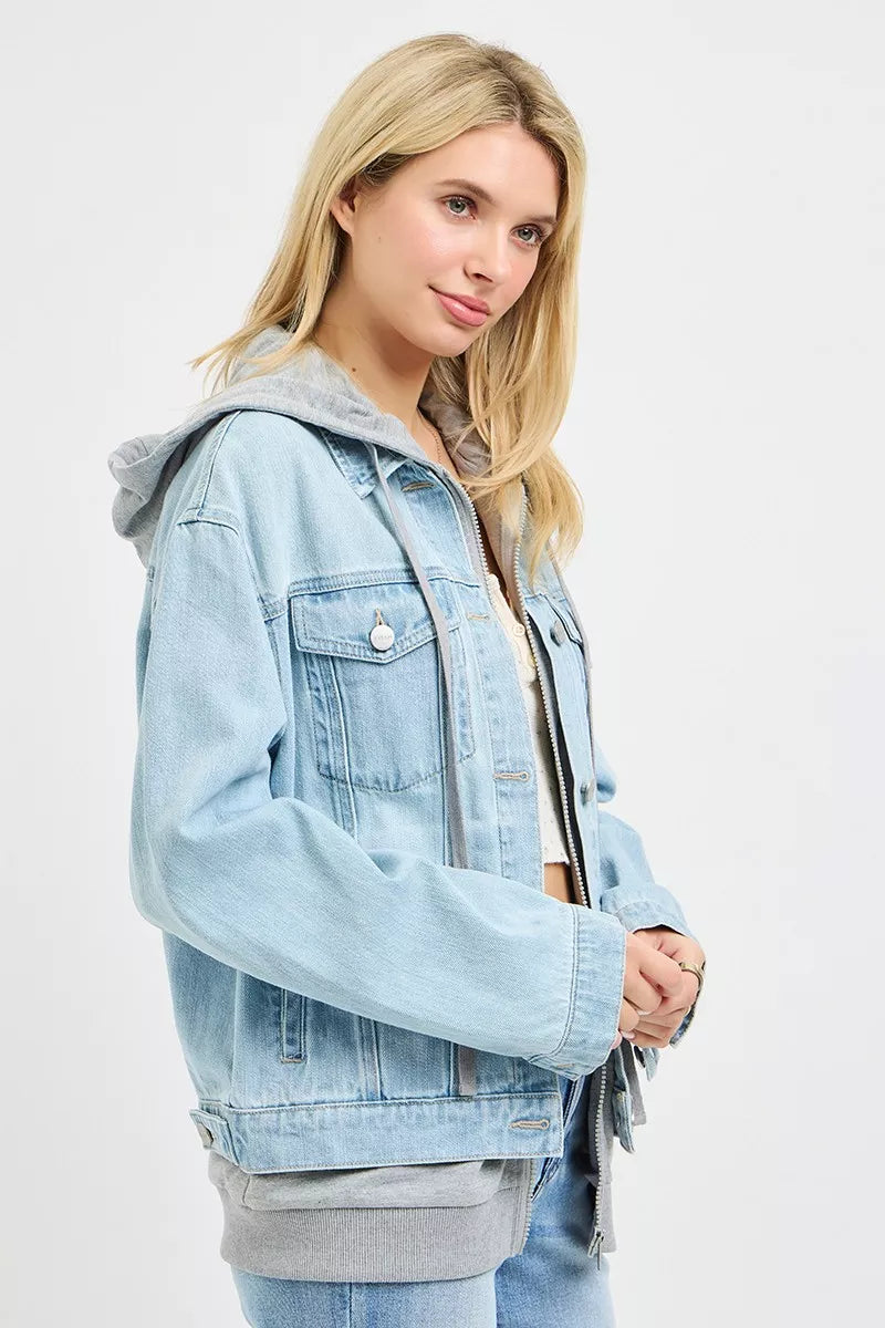 Oversized hooded light-wash denim jacket with button flap chest pockets and drawstring