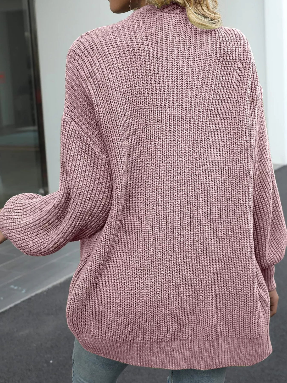 Chunky knit lantern sleeve cardigan in dusty rose, back view, textured chunky knit.