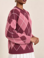 Fuzzy argyle knit sweater in mauve pink with white diamond pattern and ribbed hem