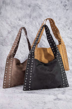 Large suede shoulder bags, brown and black, each with silver grommet strap eyelets