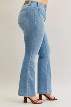 Light blue mid-rise bootcut jeans with back yoke and patch pocket detail