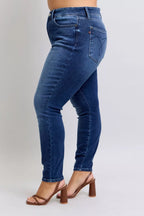 High-waist skinny jeans in dark blue wash denim, back pockets and fitted legs