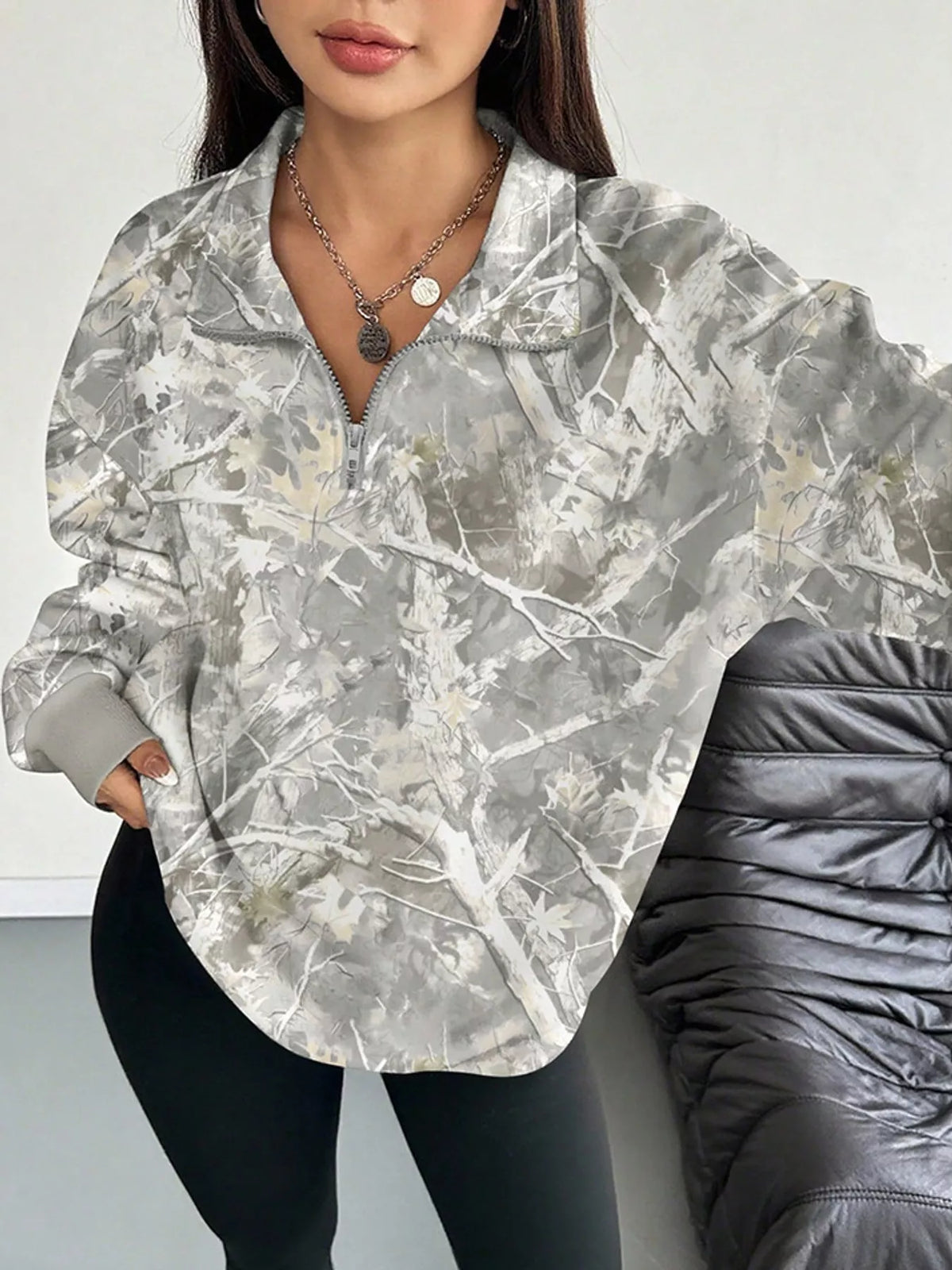 Light gray camo zip-neck oversized sweatshirt with front half-zip and relaxed fit