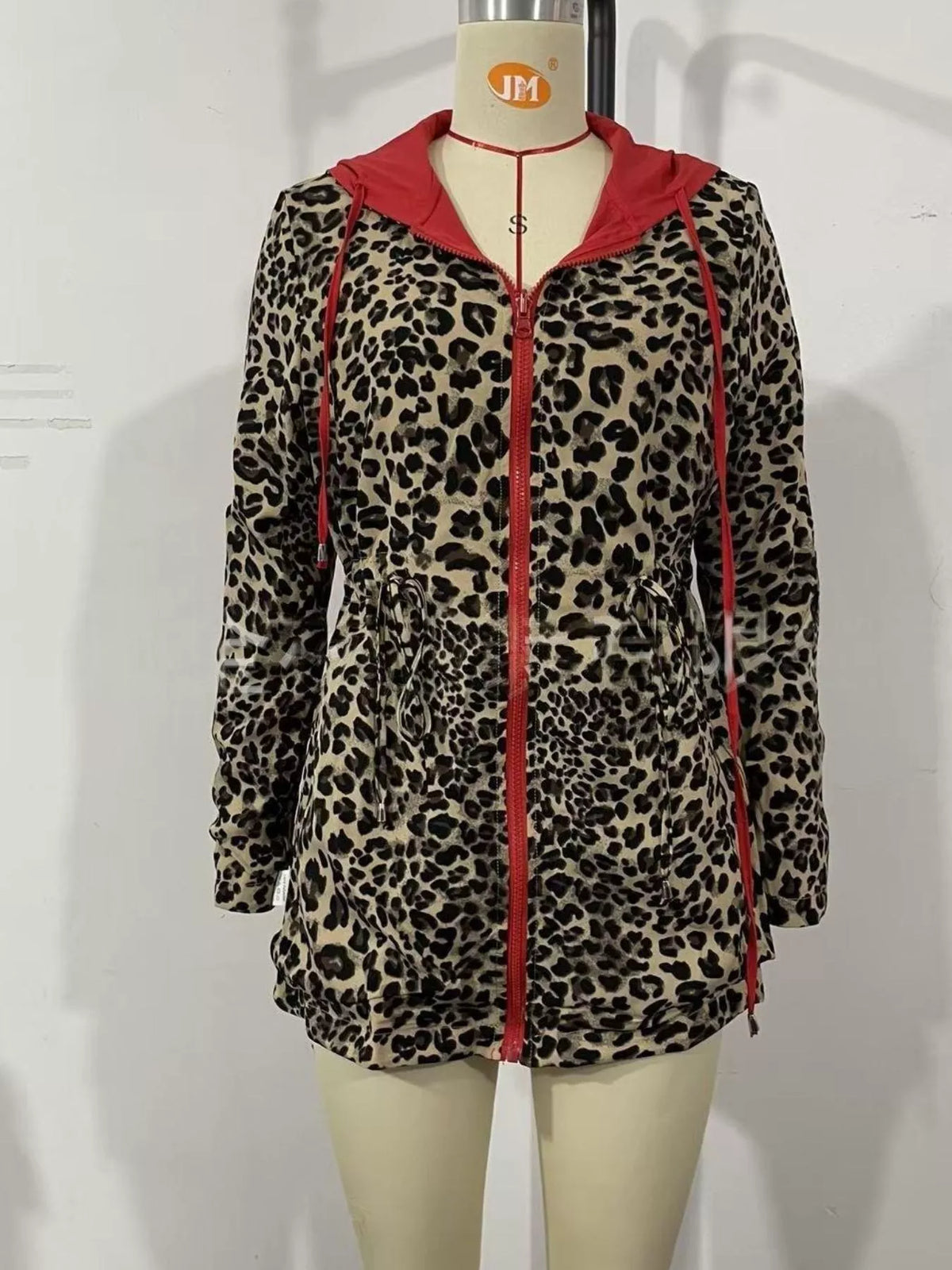 Red-hooded leopard-print jacket with zip front and drawstring waist, on mannequin
