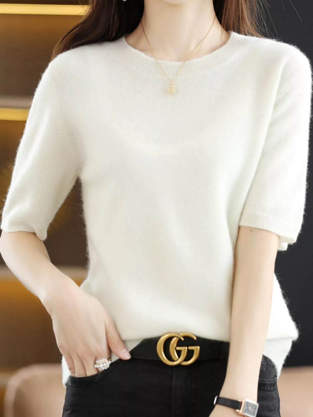White round-neck short-sleeve knit sweater with ribbed hem detail
