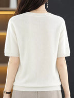 Back view of a white round-neck short-sleeve sweater