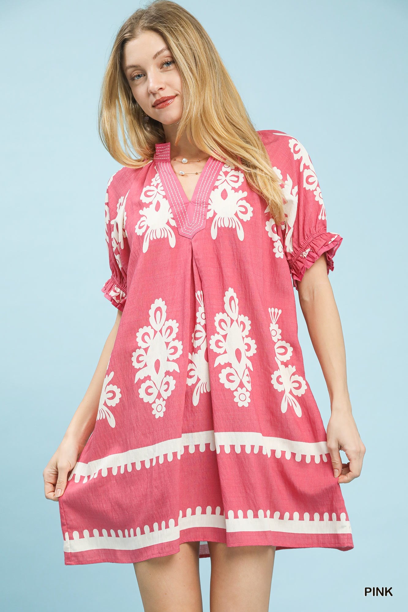 Pink ruched mini dress with white floral border print and puff sleeves
