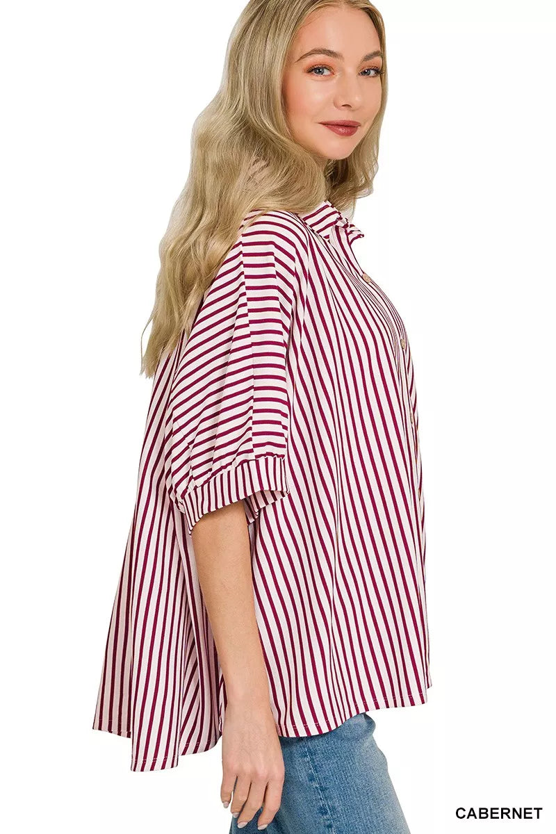 Women’s striped button-down shirt, burgundy and white vertical stripes, side view with cuffed sleeve