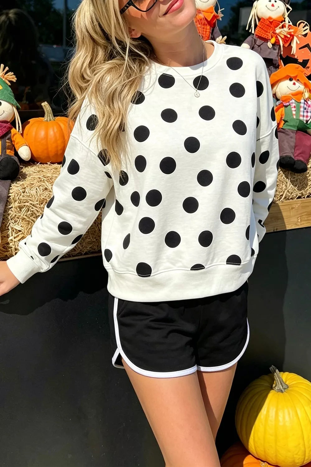 White polka dot round-neck sweatshirt with long sleeves and ribbed hem and cuffs