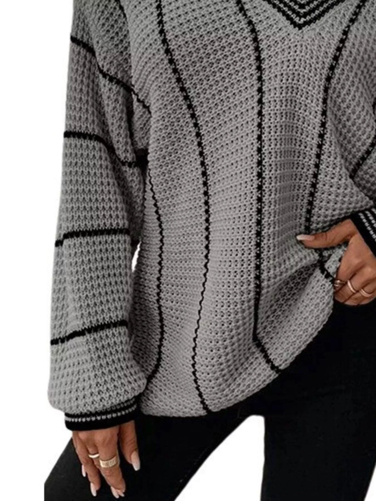 Gray textured knit sweater with black vertical stripe design and ribbed sleeve cuffs.