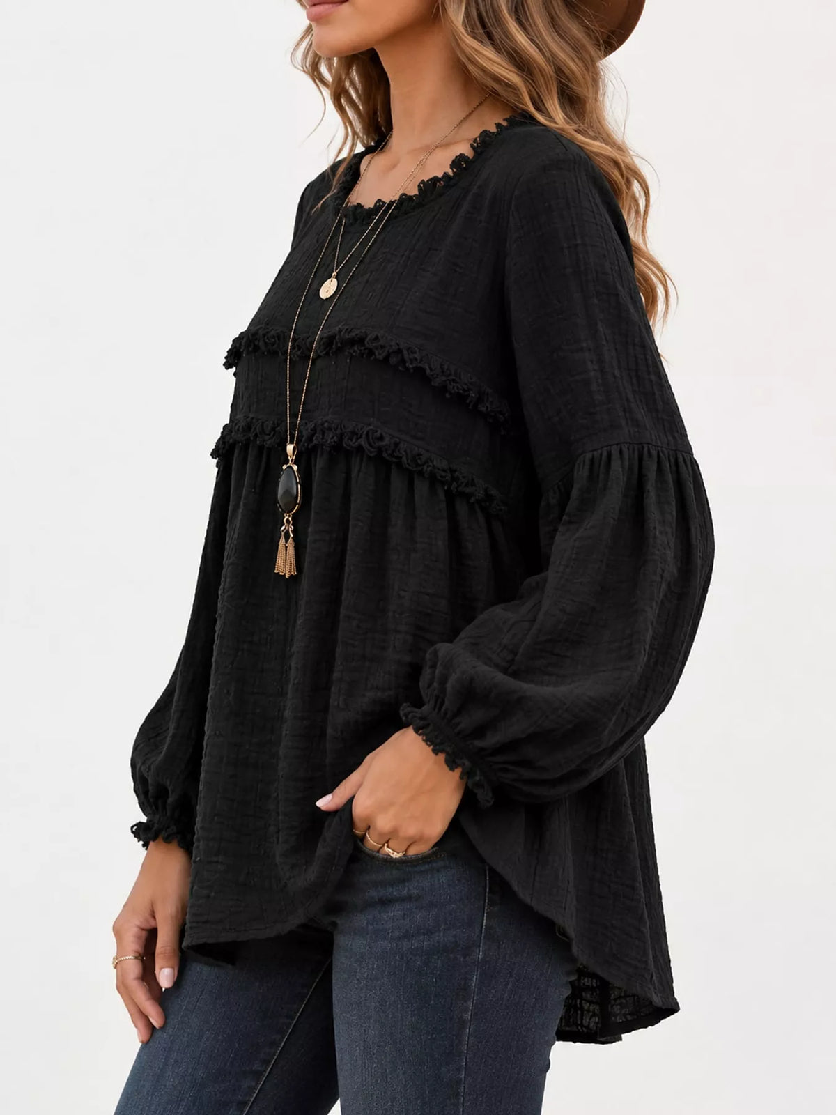 Black frayed trim peplum blouse, side view, with elastic cuffs and tiered ruffle bands