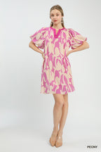 Pink and cream patterned mini dress with V-neck, puff sleeves, and mini length