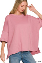 Light rose bell-sleeve scuba top with relaxed, draped fit