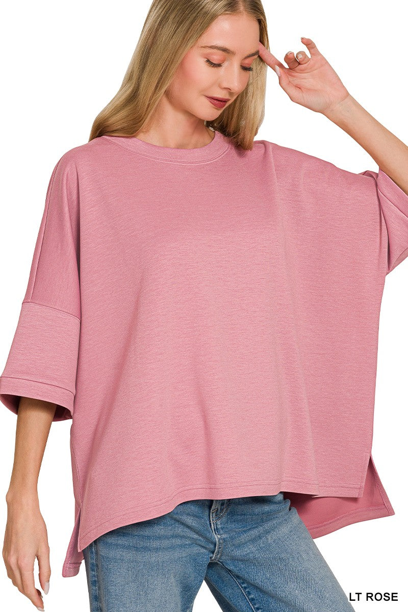 Light rose bell-sleeve scuba top with relaxed, draped fit