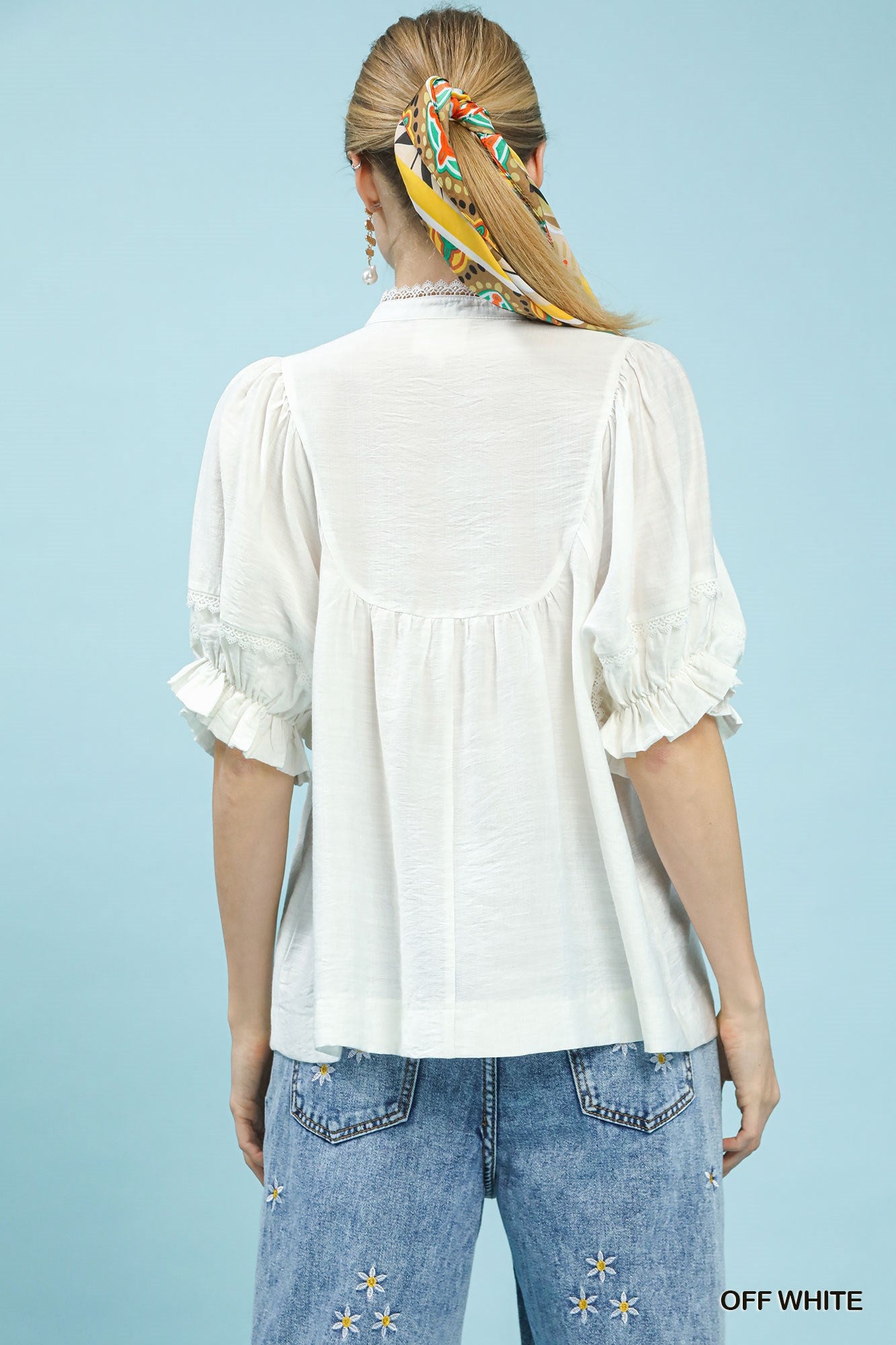 Off-white blouse back view with short puff sleeves and gathered yoke, womens top