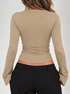 Khaki long sleeve tee back view with ruched waist and wide flared cuffs.