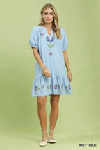 Light blue babydoll dress with embroidered floral puff sleeves and tiered skirt