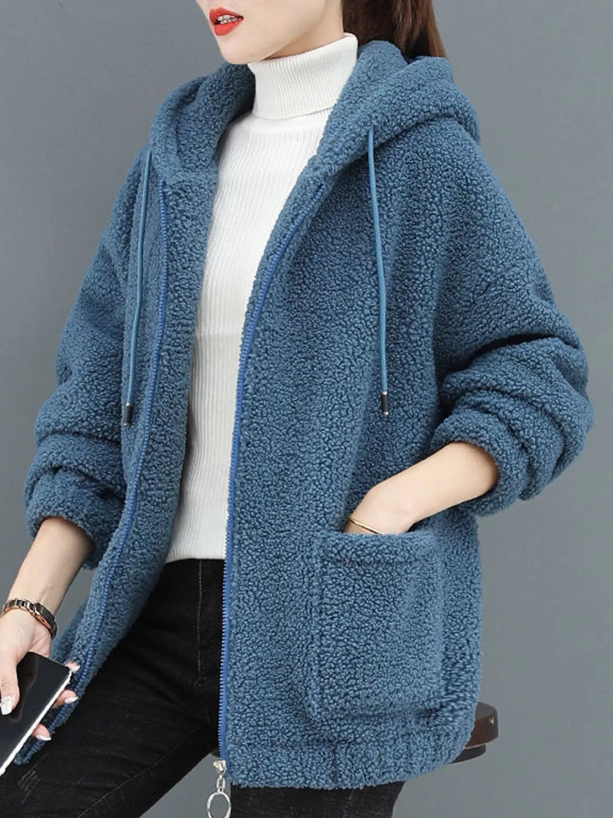 Blue fleece zip-up hoodie with hood, zipper front, and front pouch pockets