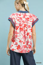 Back view flutter top with pink-and-white floral print and navy-edged neckline