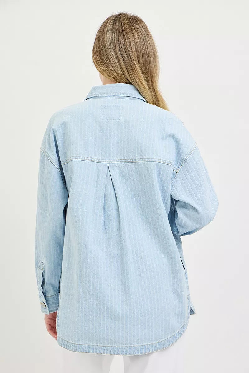 Light blue denim shacket with yoke seam and buttoned cuff