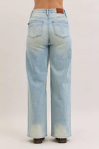 Light blue high-waist straight jeans full back view with patch pockets and waistband button