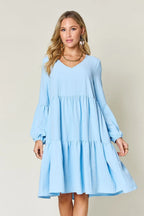 Light blue tiered V-neck balloon sleeve dress with gathered waist and flared skirt