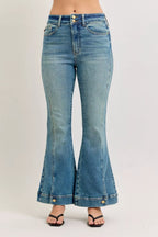 High-waist flare denim jeans with vintage wash and button-fly detail