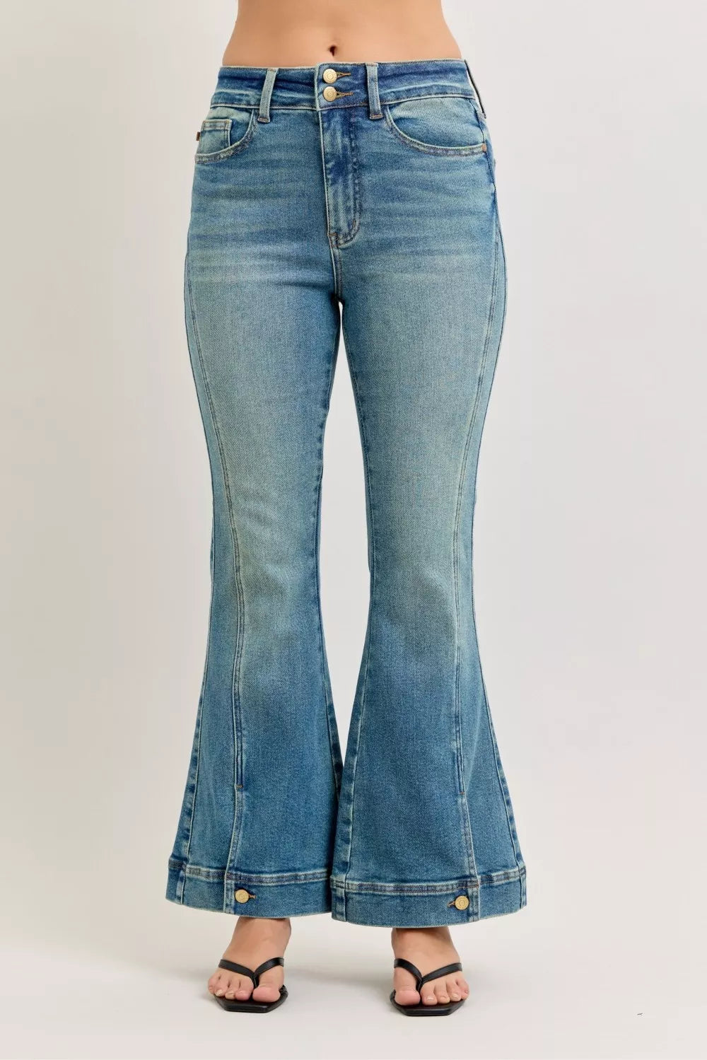 High-waist flare denim jeans with vintage wash and button-fly detail