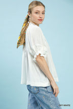 Off-white blouse with puff ruffle sleeves, gathered cuffs, and loose fit for women