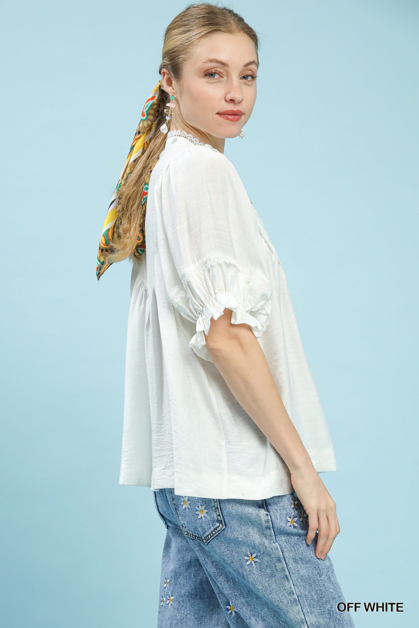 Off-white blouse with puff ruffle sleeves, gathered cuffs, and loose fit for women