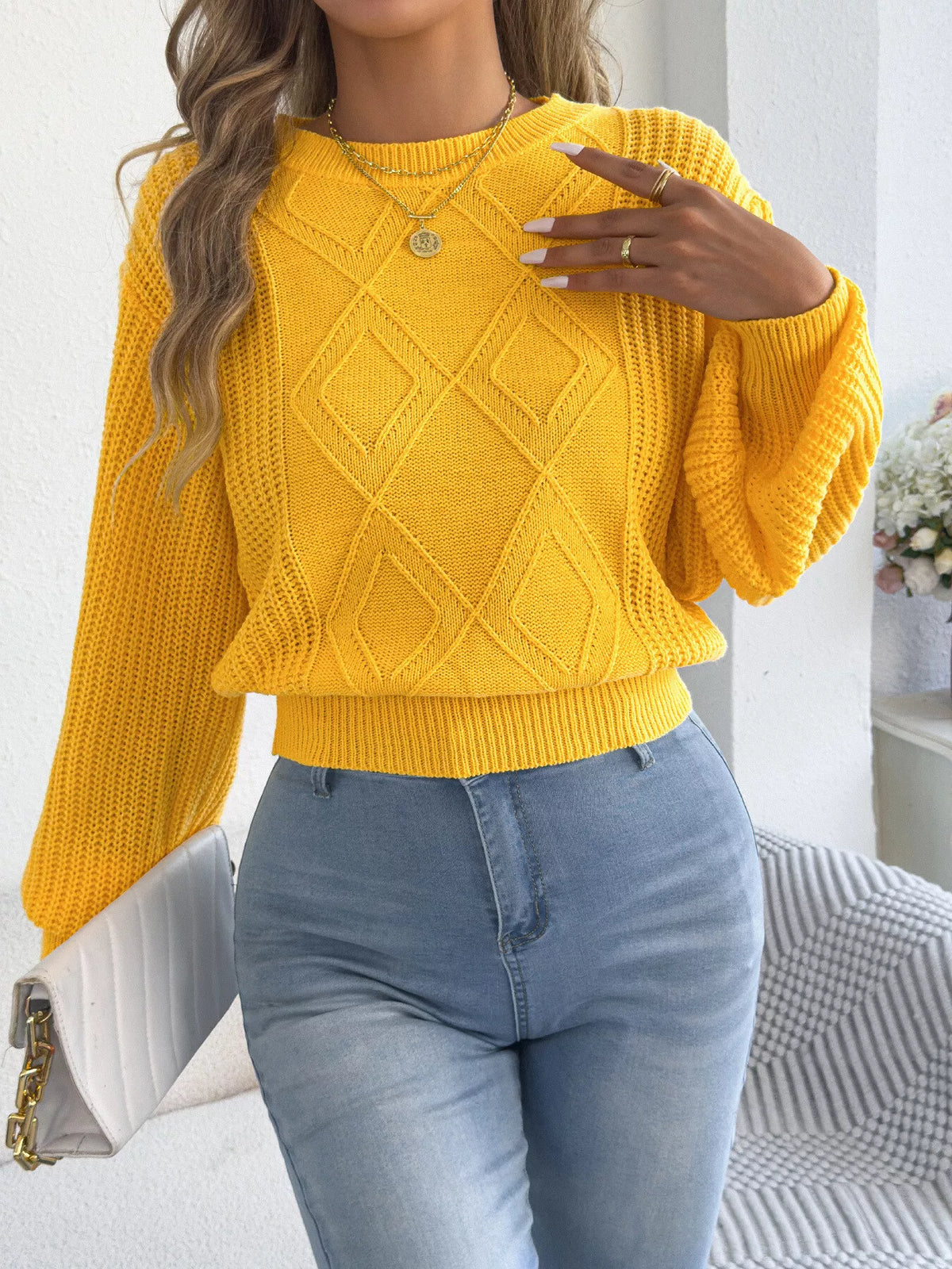 Yellow argyle knit lantern-sleeve sweater with crew neck and ribbed cuffs