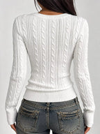 White cable-knit sweater, long sleeves, textured back with fitted ribbed hem