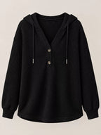 Black waffle-knit button hoodie with hood, drawstrings, and snap front buttons