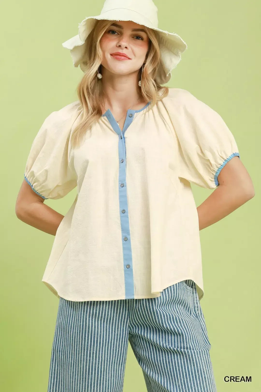 Cream puff-sleeve button-front blouse with blue contrast trim and collar