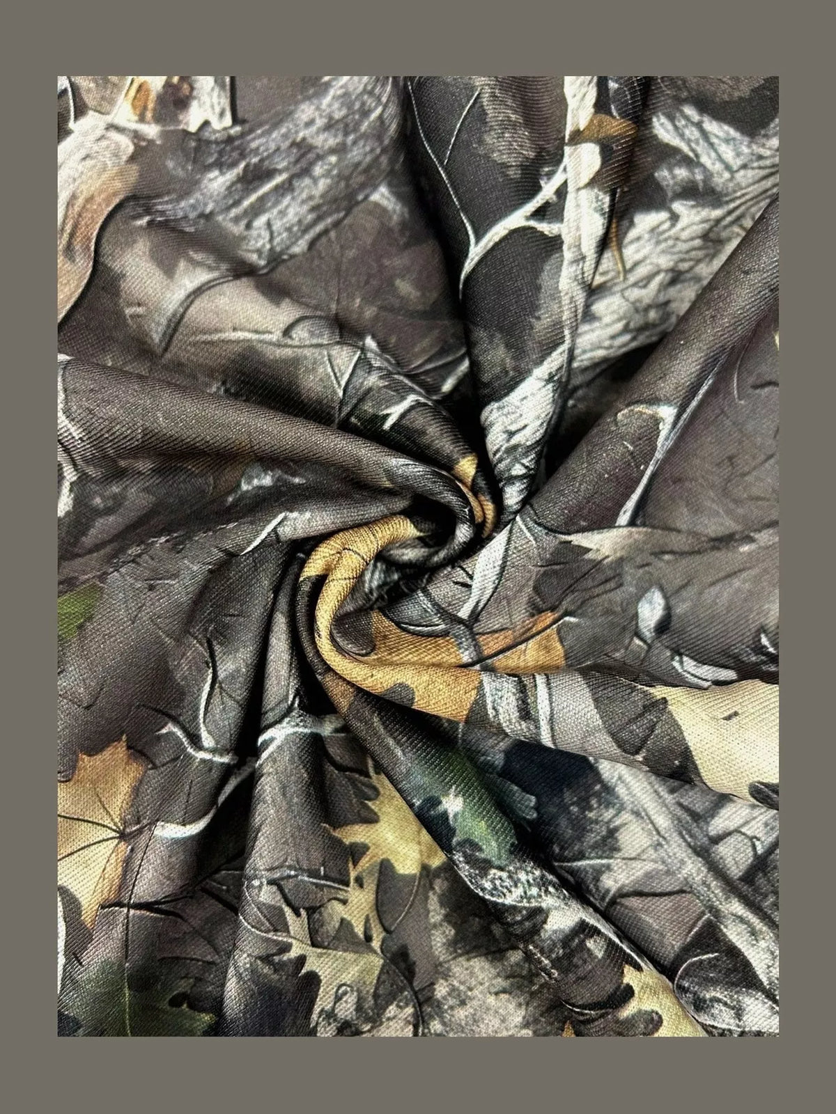 Camo sweatshirt fabric close-up with multitone pattern and knit texture