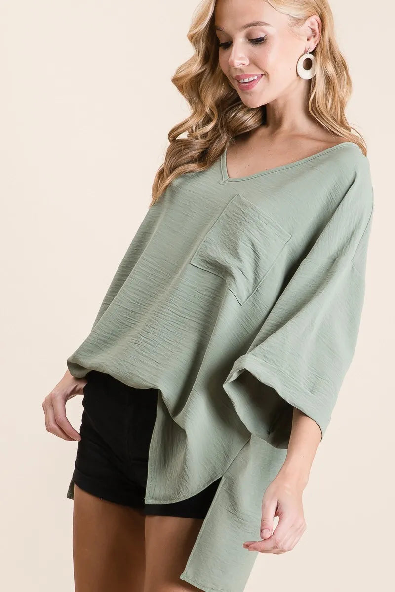 Sage Green Oversized V-Neck Blouse – High-Low Hem & Chest Pocket