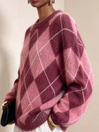 Fuzzy argyle knit sweater, fuchsia/pink with white diamond pattern; long sleeves.