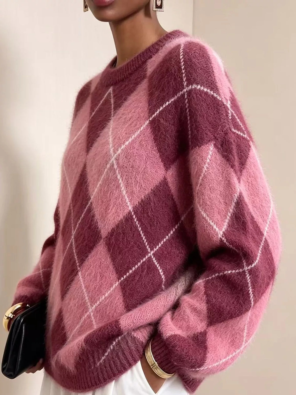 Fuzzy argyle knit sweater, fuchsia/pink with white diamond pattern; long sleeves.